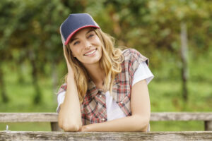 female model wearing a trucker hat