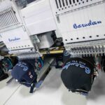Multi-head commercial embroidery machine and caps
