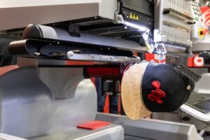 Commercial embroidery machine and cap