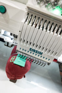 Cap frames for embroidery hooping