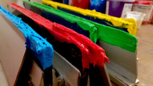 Squeegees coated in screen printing ink