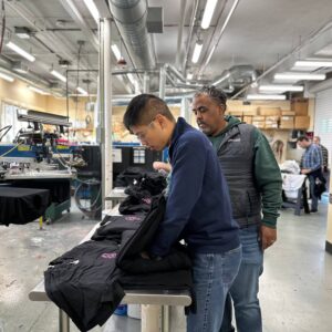 Spectrum Designs production workers customer apparel shop