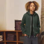 Young model wearing BELLA+CANVAS zip hoodie