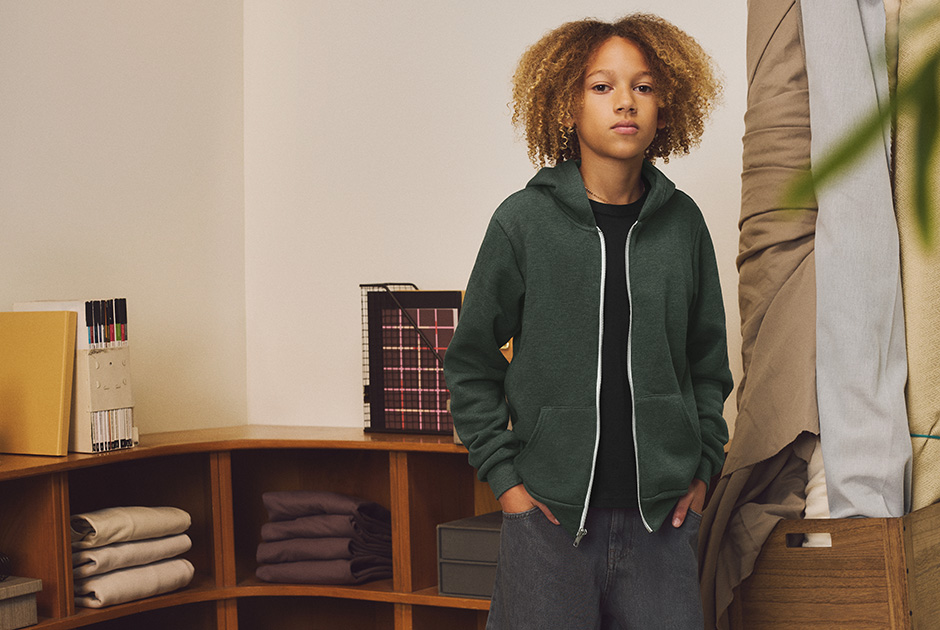 Young model wearing BELLA+CANVAS zip hoodie