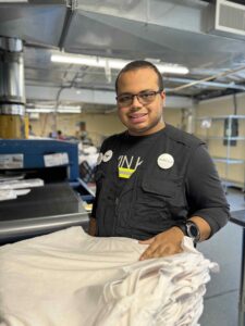 Spectrum Designs custom apparel shop Winston production worker