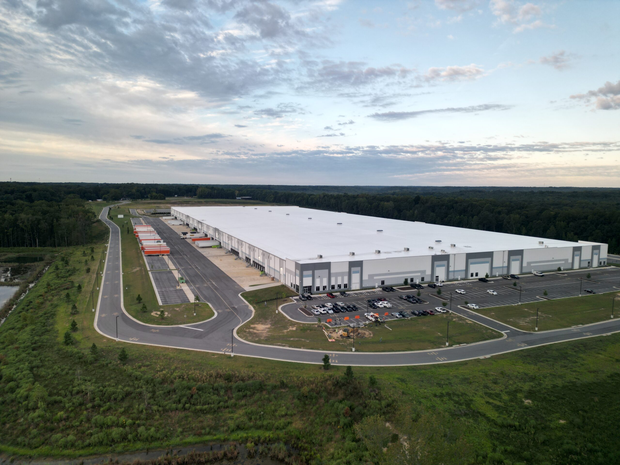 Exterior of SanMar Richmond Distribution Center with guests attending grand opening ceremony.