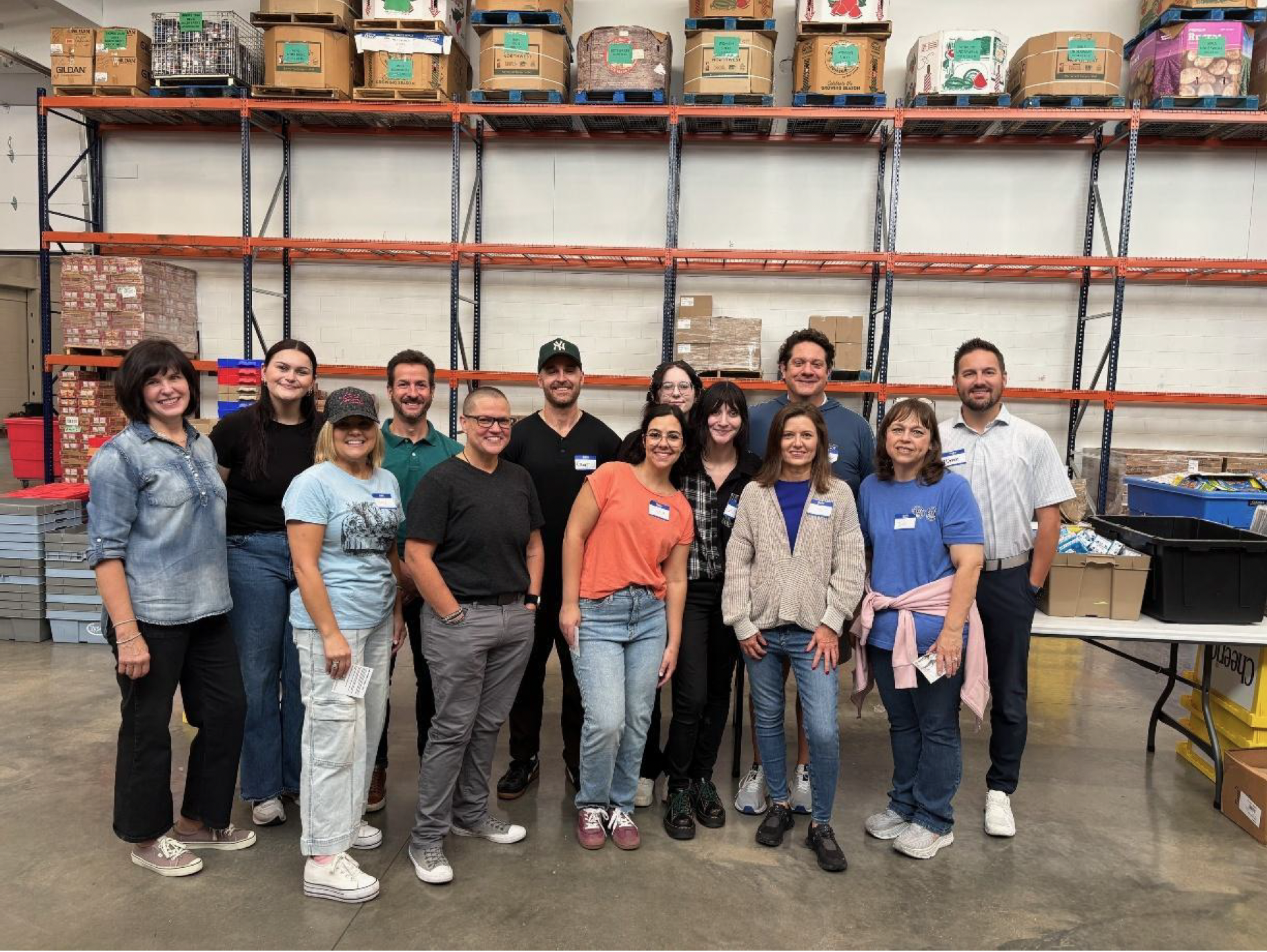 Infinity Product Group employees volunteering at the Samaritan Community Center SnackPack Program, packing meals for Northwest Arkansas children facing food insecurity