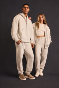 Models wearing BELLA+CANVAS 2026 fleece styles, including zip hoodies and joggers, showcasing elevated comfort and clean silhouettes.
