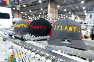 Embroidered hats at the 2026 Impressions Expo decorated apparel industry trade show, March 25-28
