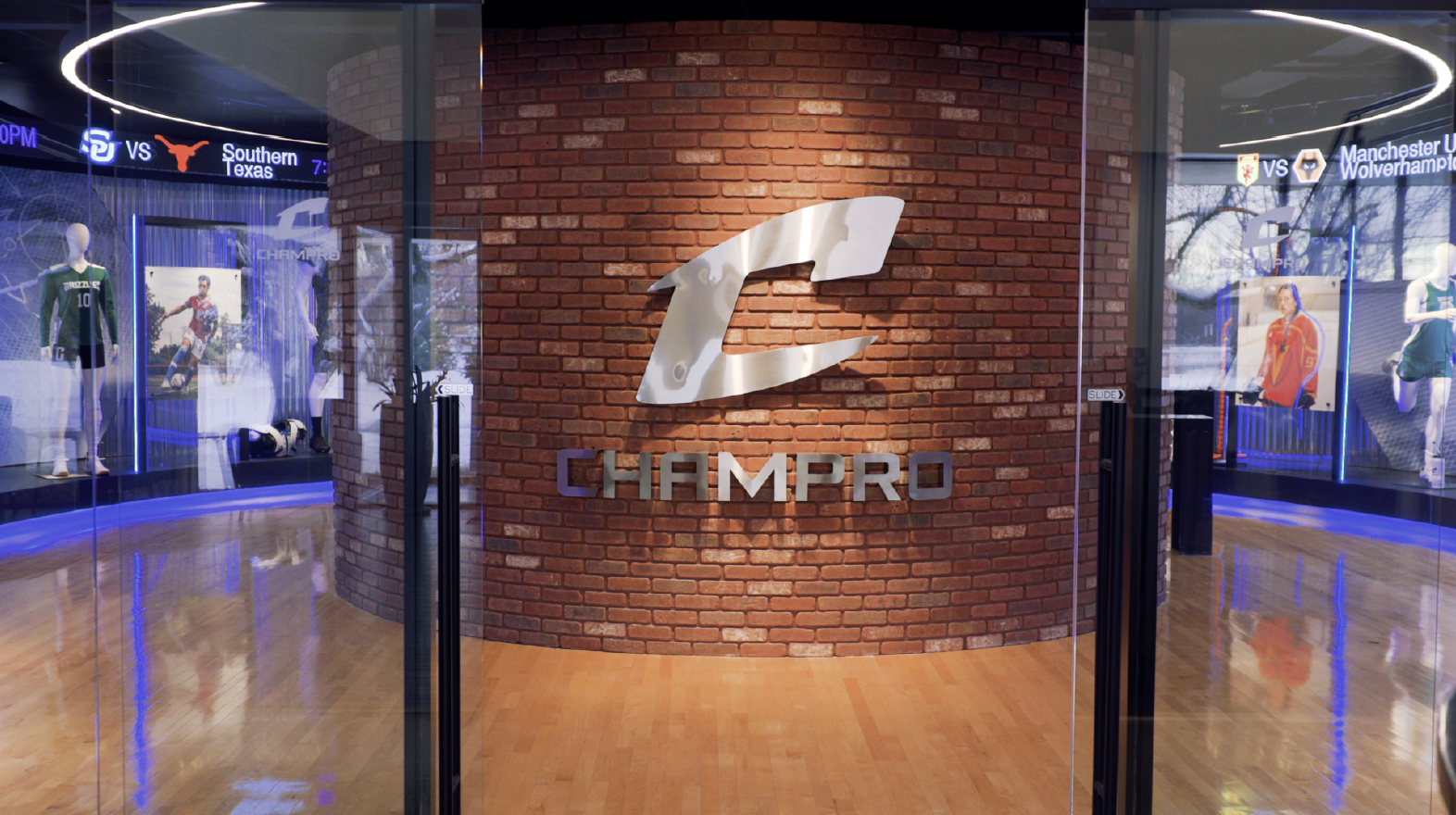 Champro sporting goods showroom featuring athletic uniforms, sports equipment displays and the Champro logo.