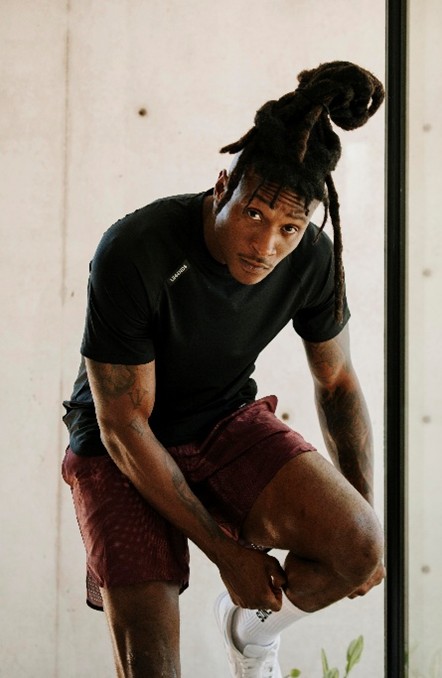 Model wearing Legends performance T-shirt and athletic shorts showcasing premium athleisure apparel distributed by S&S Activewear