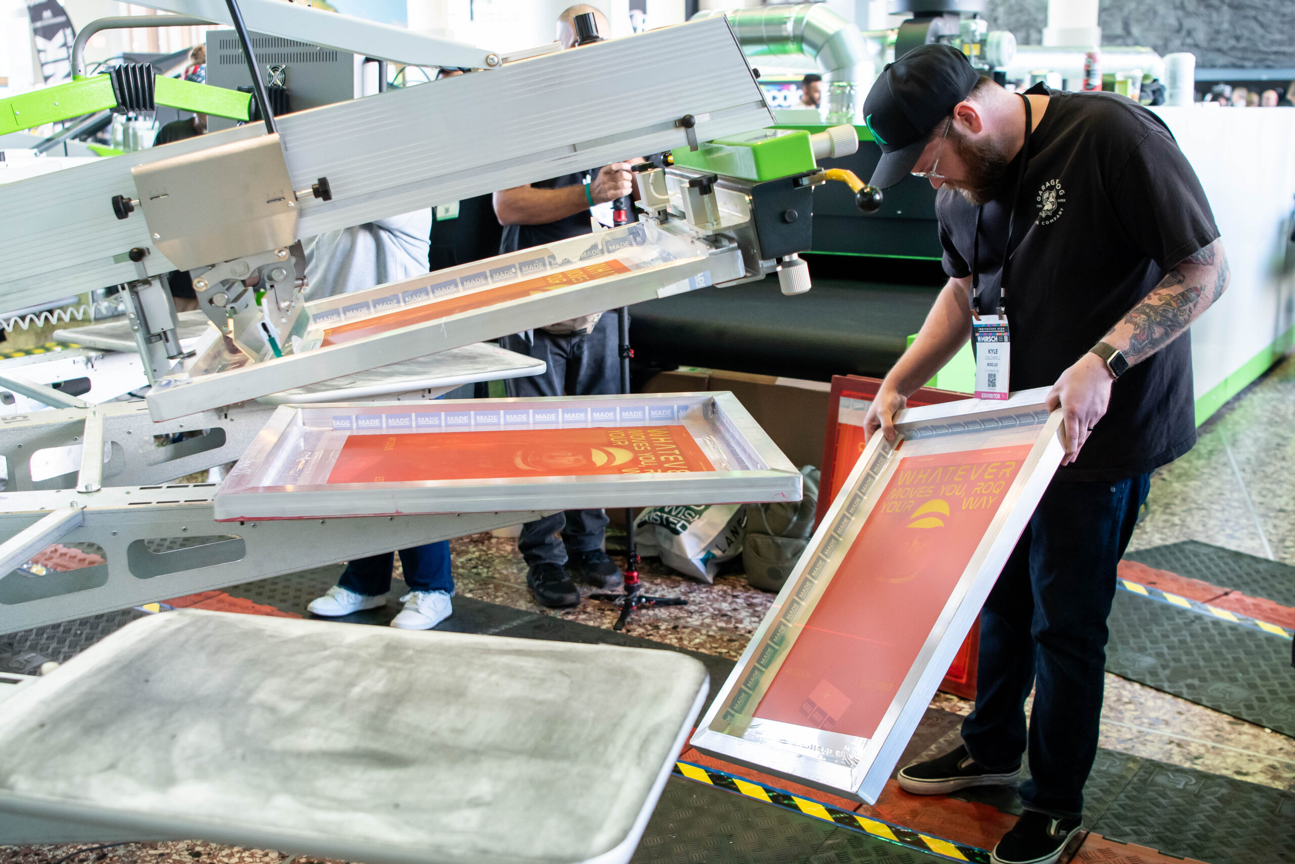 Custom decorated apparel and T-shirt screen printing press at the Impressions Expo decorated apparel industry trade show