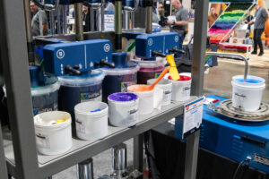 Avient DMC DispenseMaster for apparel screen printing at the Impressions Expo decorated apparel trade show