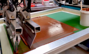 High-tension screen-printing mesh creating smooth ink flooding and consistent print coverage during textile screen printing.
