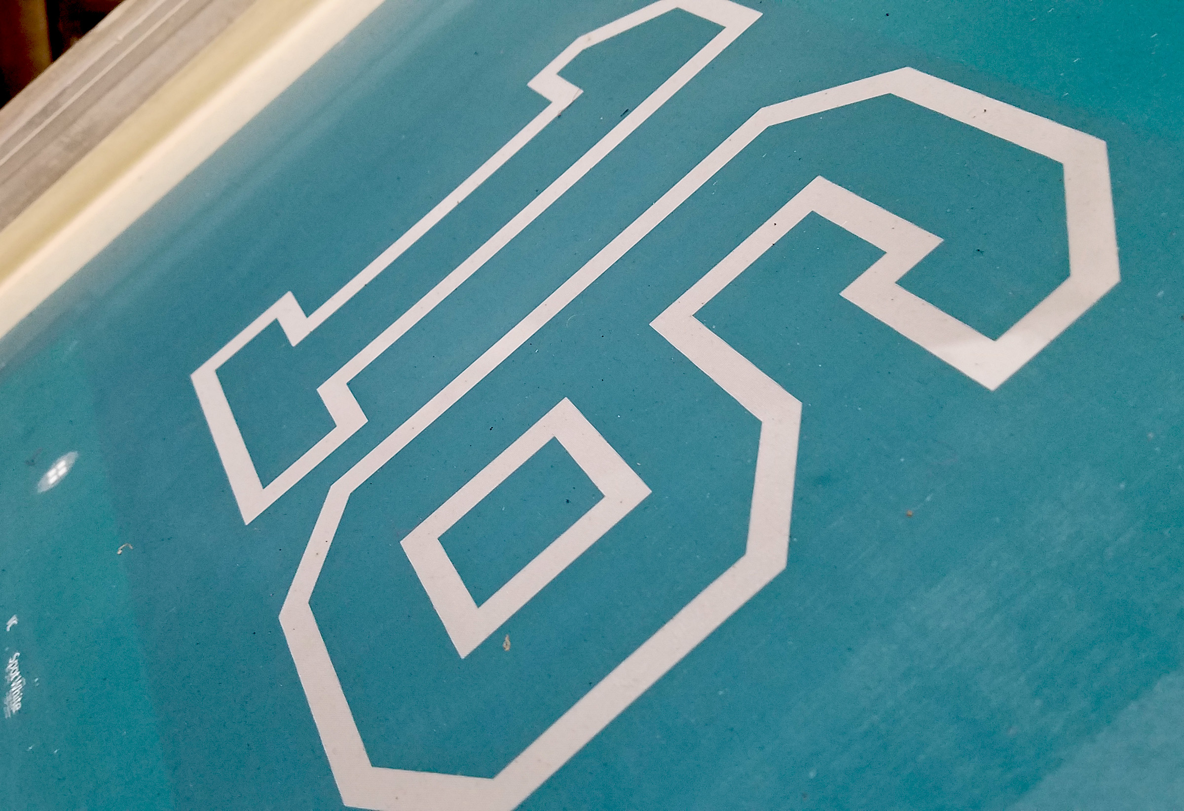 Screen-printing stencil with tight mesh tension producing sharp edges and detailed print registration.