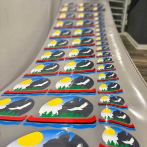 Finished DTF gang sheet transfers with vibrant full-color graphics ready for heat application