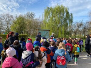 Children participate in an environmental education program at Bosco dei Racconti, Atlantis Headwear’s sustainability forest initiative in Italy focused on biodiversity and carbon sequestration.