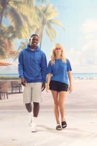 Models wearing AWDis activewear and athleisure apparel, including performance T-shirts, hoodies, and sweatpants designed for everyday comfort and casual lifestyle wear.