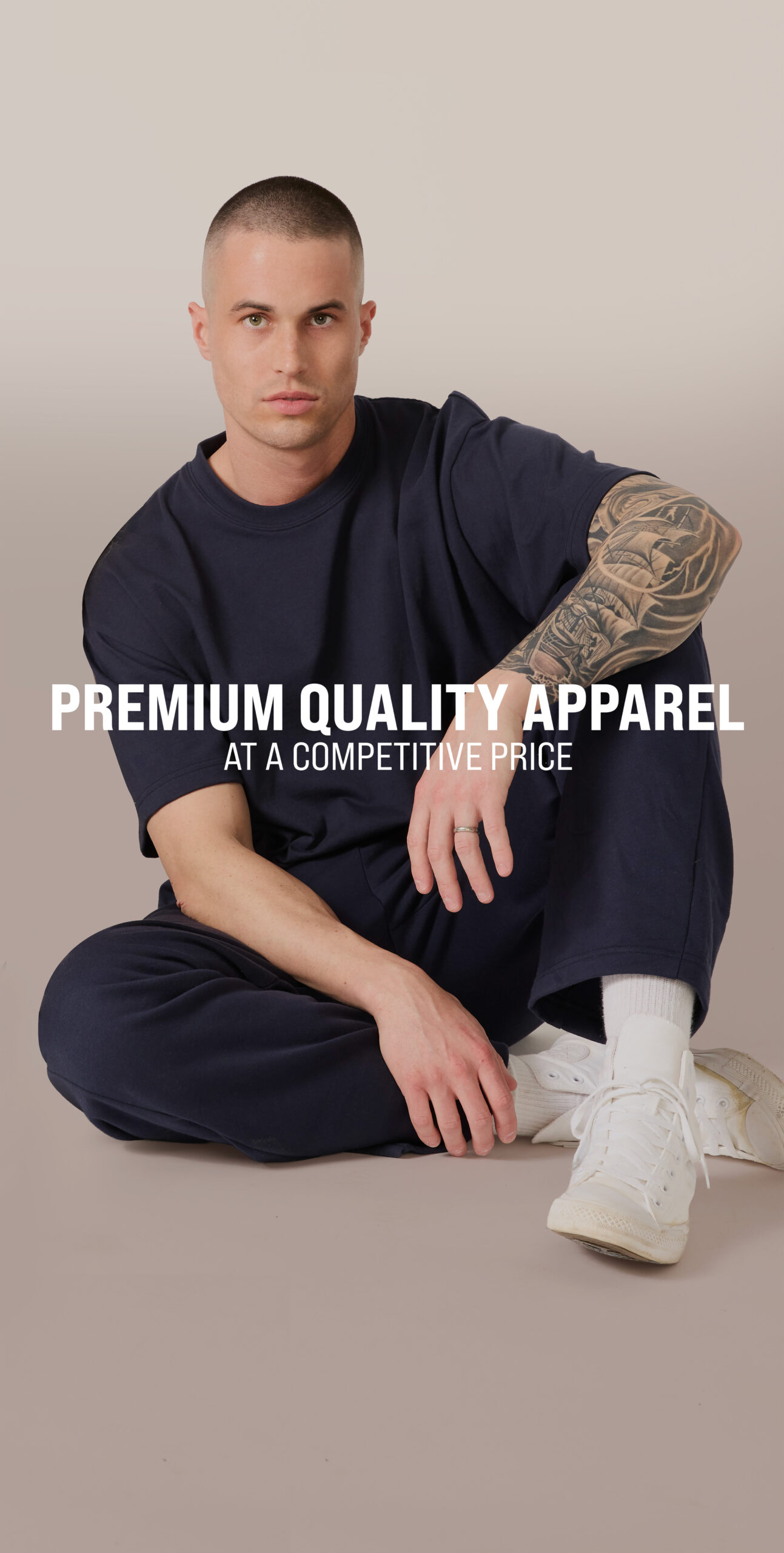 Model wearing Basic Supply Co. premium blank apparel from Royal Apparel, highlighting competitively priced decorator-friendly clothing for screen printing, embroidery, and promotional products.