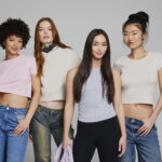 Models wearing Lane Seven women's apparel collection featuring cropped T-shirts, fleece hoodies and modern silhouettes that reflect 2026 women's fashion and blank apparel trends.