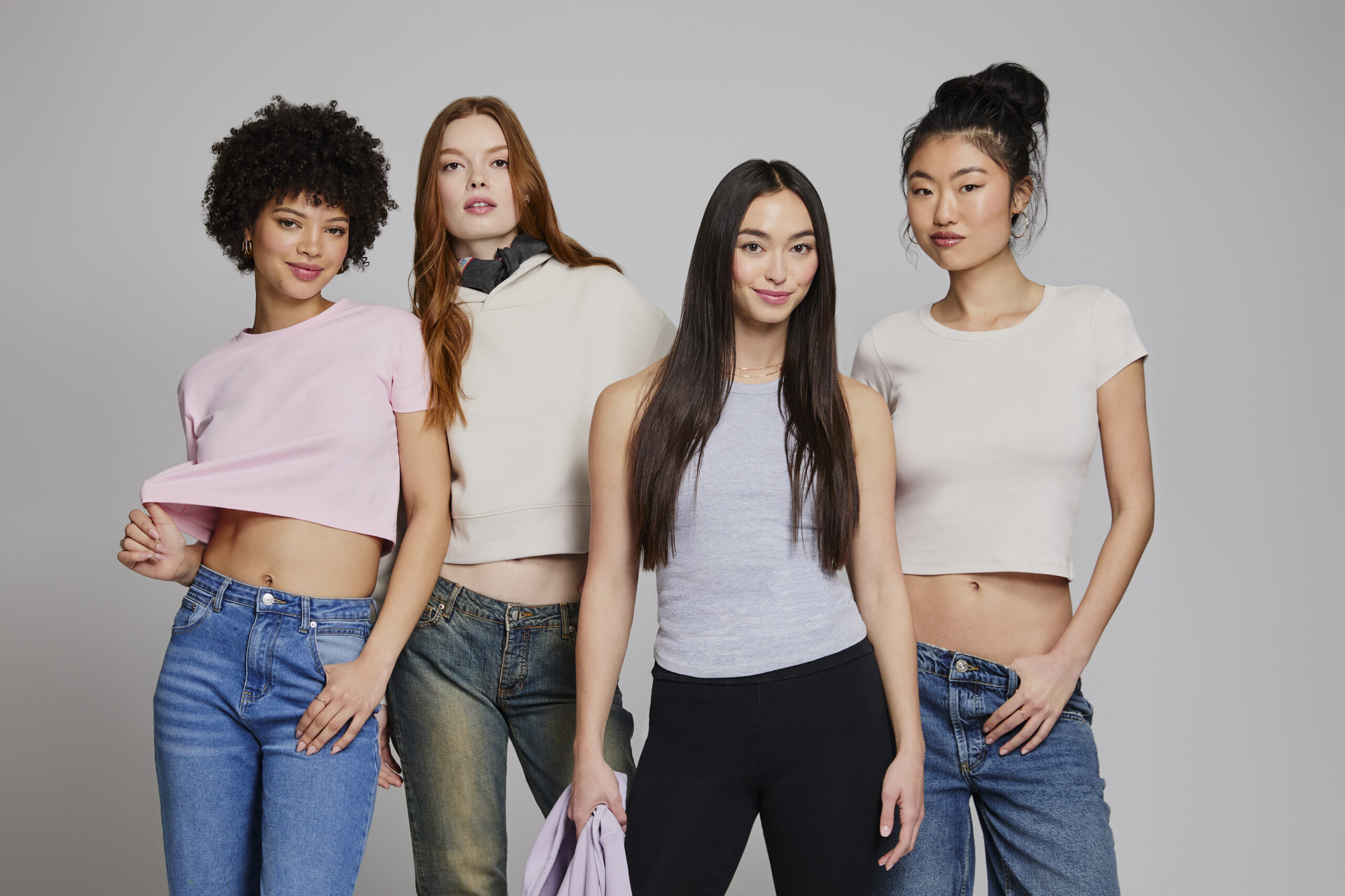 Models wearing Lane Seven women's apparel collection featuring cropped T-shirts, fleece hoodies and modern silhouettes that reflect 2026 women's fashion and blank apparel trends.