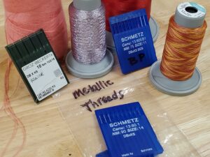 Custom embroidery needles, specialty threads