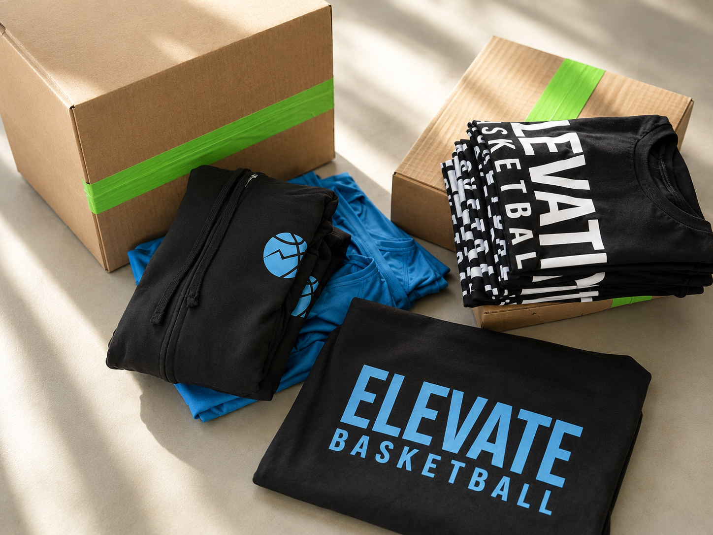 Decorated apparel and shipping boxes representing Howard Custom Transfers HCT Assist fulfillment service
